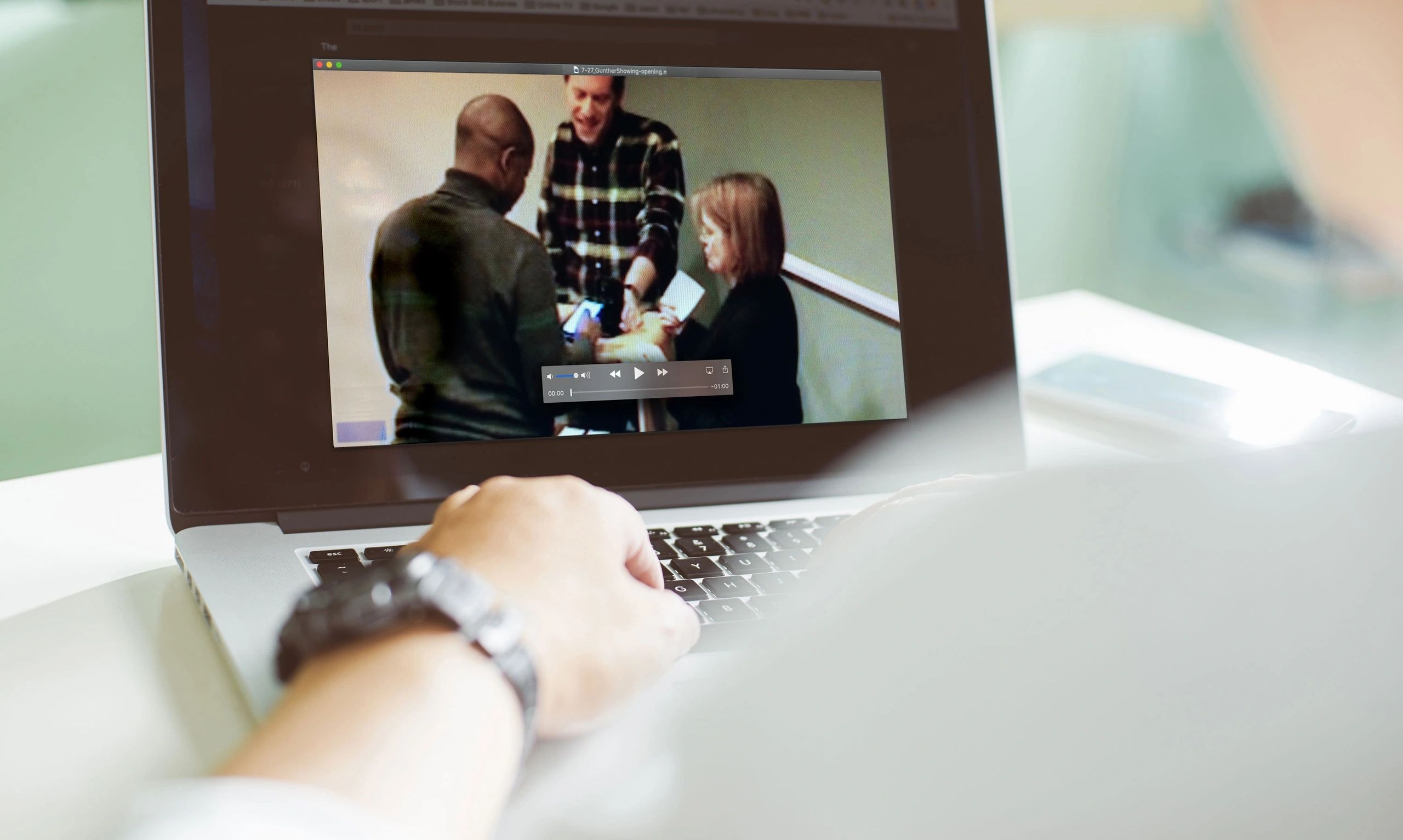 Researcher reviewing user research on a laptop